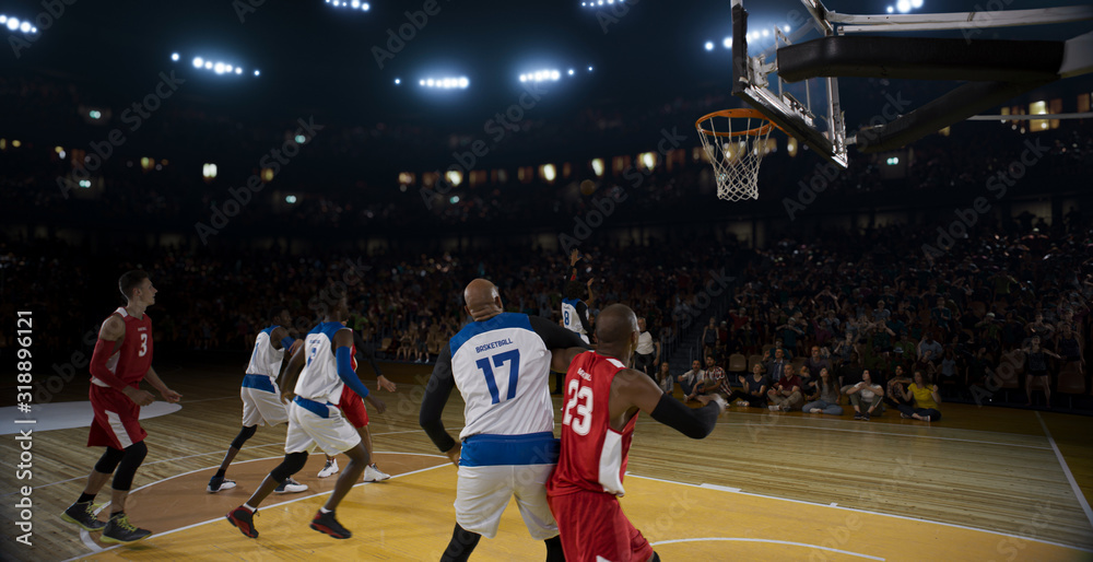 Obraz premium Basketball players on big professional arena during the game. Tense moment of the game.