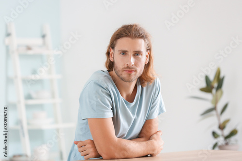 Handsome man in kitchen at ...