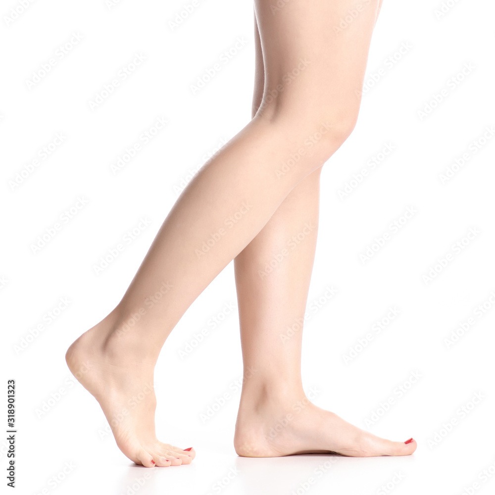 Woman female legs feet goes beauty on white background isolation Woman female legs feet goes beauty on white background isolation