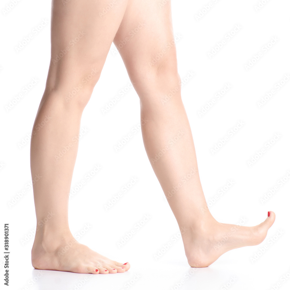 Woman female legs feet goes beauty on white background isolation Woman female legs feet goes beauty on white background isolation