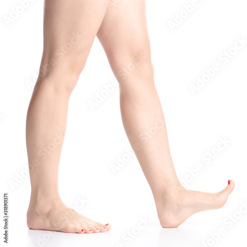 Woman female legs feet goes beauty on white background isolation © Kabardins photo