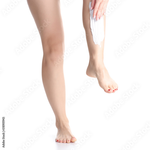 Female legs shaving foam razor on white background isolation © Kabardins photo