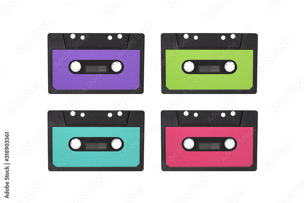 Fototapeta premium Four magnetic tape cassettes of the 80 s, 90 s. Retro cassettes isolated on white background. Magnetic tape cassette for audio painted in pink and green color, copy space. Retro music concept
