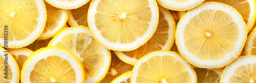 Sliced lemons. Background and texture. Panorama.