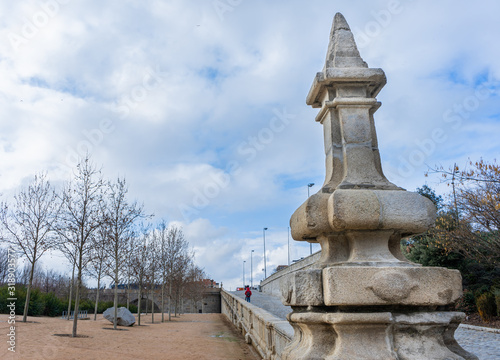 Entrance to Madrid Río Park, under the Toledo Bridge on a cloudy day, travel concept