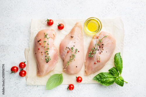 Stampa su tela Fresh raw chicken breast with herbs and spices, top view