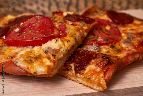 Cheese, tomato and sausage pizza