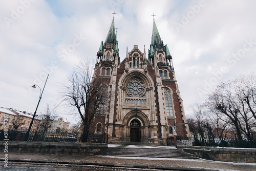 Olga and Elizabeth church in Lviv. Baroque and Gothic architecture. Steeples on the towers. Vaulted window on facade of the building. Lviv, Ukraine.