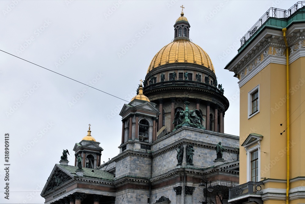 St. Petersburg, Russia, January 2020. Gilded domes of St. Isaac`s Cathedral on a background of a winter sky.
