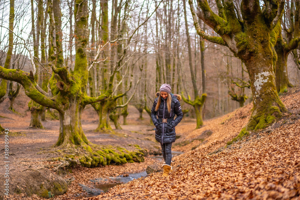 Lifestyle, a beautiful young woman in a beautiful forest in autumn, in Bizkaia