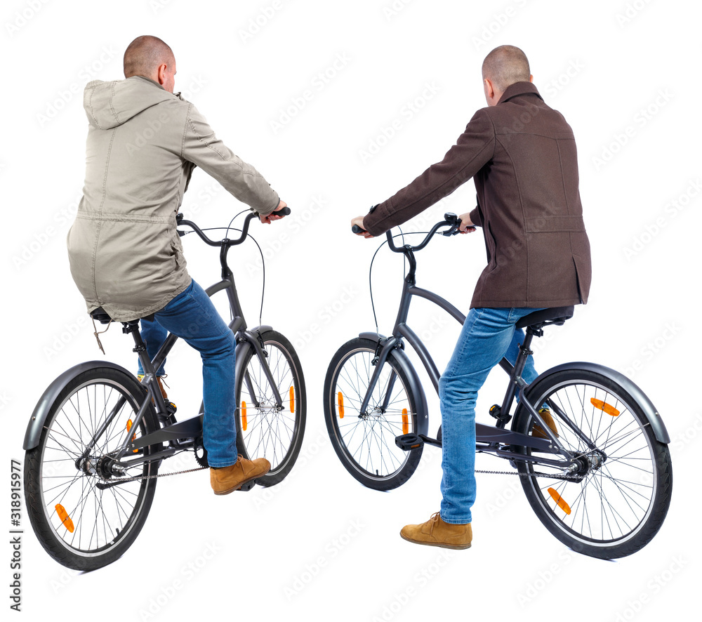 Back view of two man on a bicycle in winter jacket.