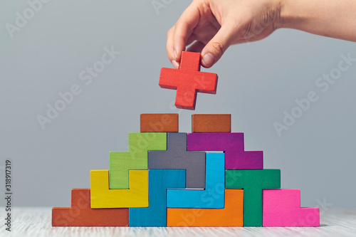 Obraz na plátně Hand arranging wood cube stacking as step stair
