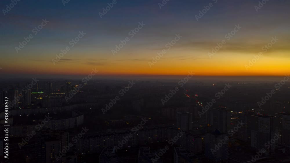 Beautiful sunset over the city, aerial view, hyperlapse. Bright clouds above the townscape after sunset. Beautiful sunset over the city, aerial view, hyperlapse. Bright clouds above the townscape after sunset.