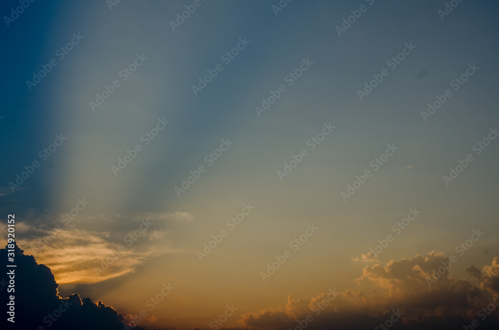 Sunset / sunrise with clouds, light rays and other atmospheric effect
