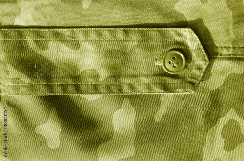 Part of military camo uniform in yellow tone.