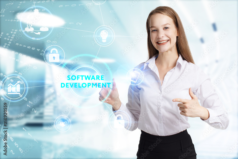 Business, Technology, Internet and network concept. Young businessman working on a virtual screen of the future and sees the inscription: Software development Business, Technology, Internet and network concept. Young businessman working on a virtual screen of the future and sees the inscription: Software development