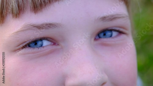 Blue eyes of a smiling girl