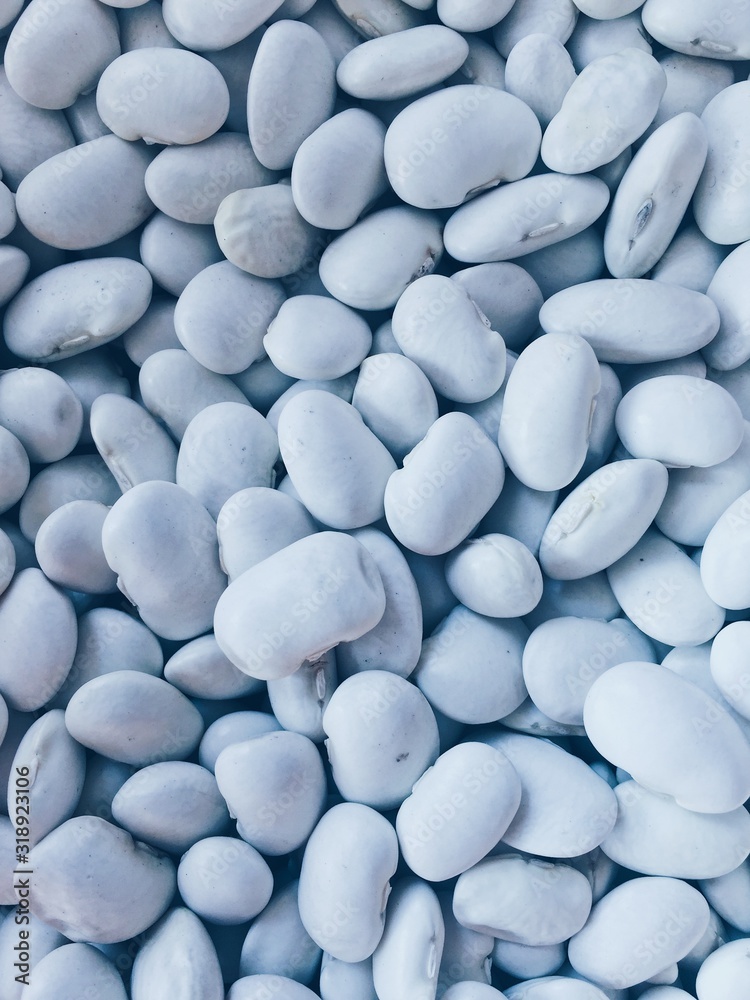 Background with white beans. Blue texture Background with white beans. Blue texture
