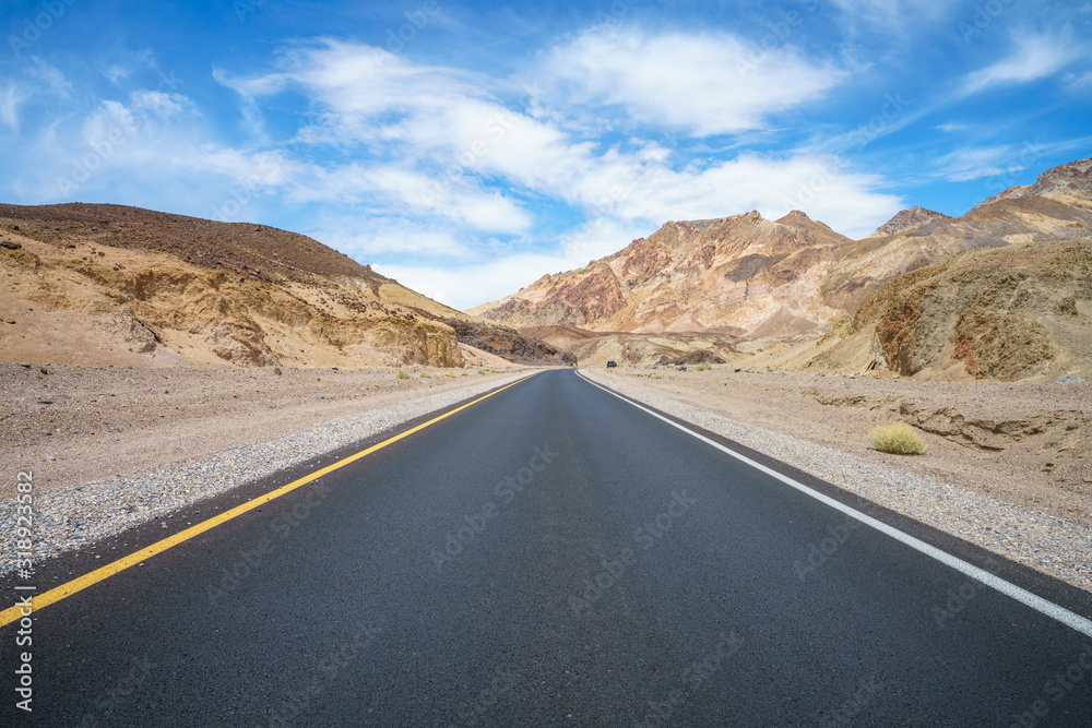 on the road on artists drive in death valley national park, california, usa on the road on artists drive in death valley national park, california, usa