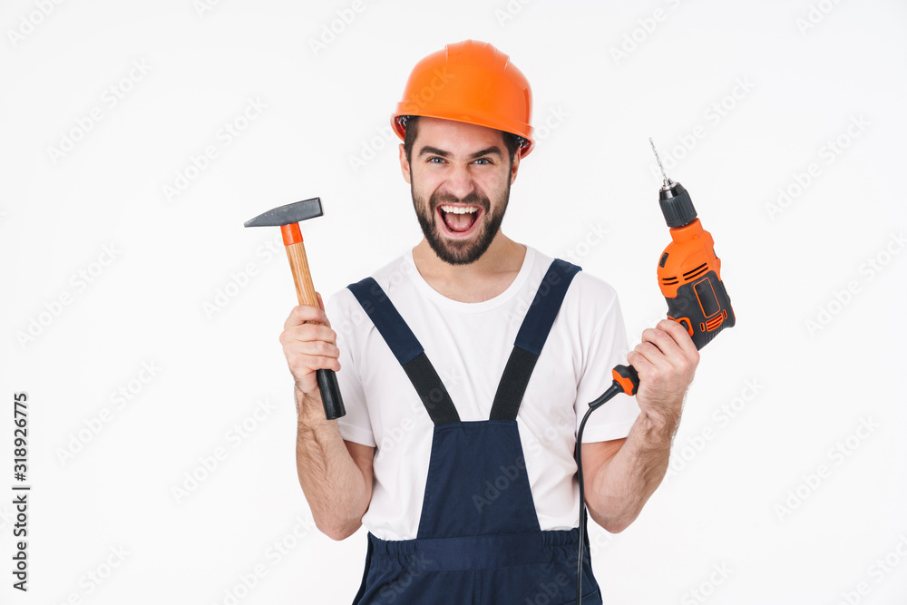 Man builder holding drill and hammer. Man builder holding drill and hammer.