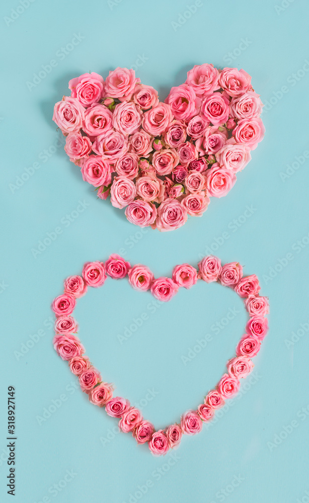 Valentine's day banner.Holiday card with a heart of pink roses on a blue background.Congratulation.Creative.diy.Women's day.Mother's day.love.postcard.Banner.Vertically.