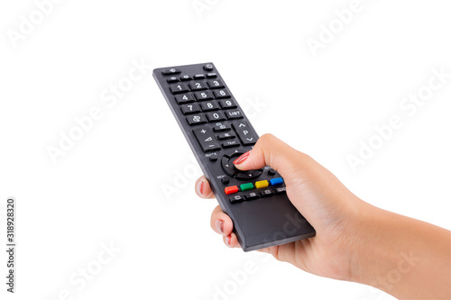 Woman hand holding TV remote control with clipping path isolated on white background. photo