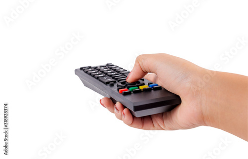 Woman hand holding TV remote control with clipping path isolated on white background. photo
