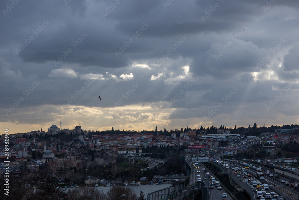 Istanbul/Turkey - 01.23.2020: A city view in Istanbul's old district Halicioglu with rays thought clouds