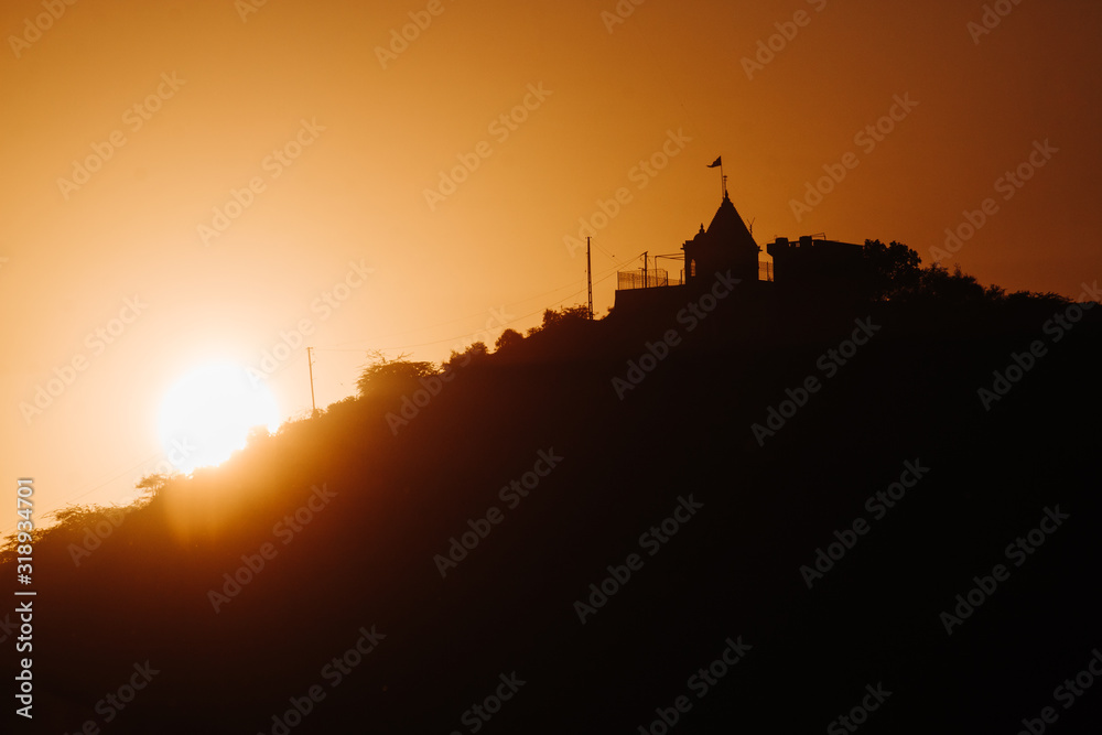 Sunset besides the temple on hill