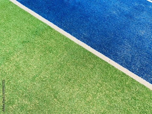 field with lines of grass. Tennis court