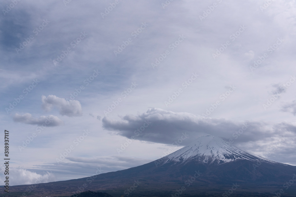 Snowcapped and cloud hat phenomena against the most beautiful volcano of the world Mt. Fuji.