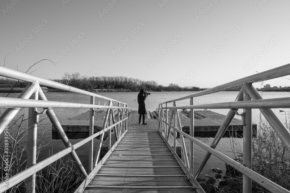 Walkway ramp to lake boat dock. Steel ramp walkway leading to boat dock ...