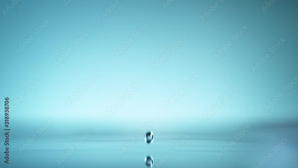 Macro shot of water drop over the water , relaxation with water ripple drops concept , filmed on cinema slow motion camera at 1000 fps