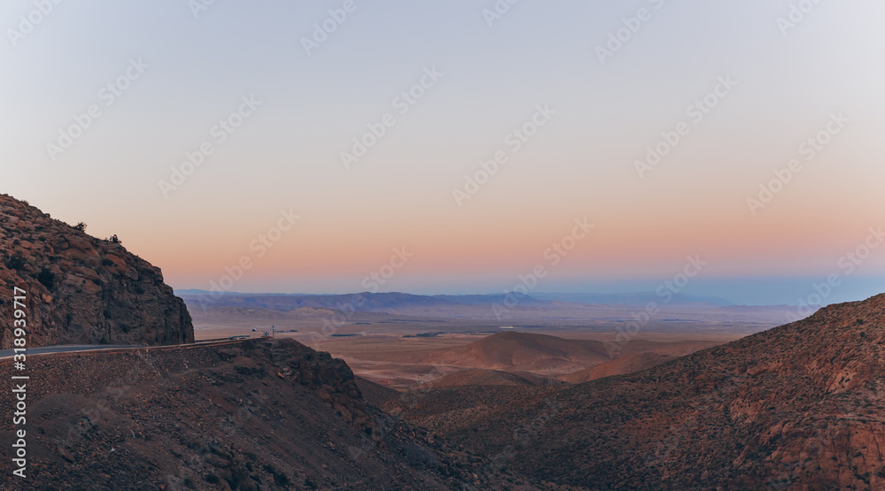 Fototapeta premium Mountain road in morocco. Sunset landscape. View of the valley.