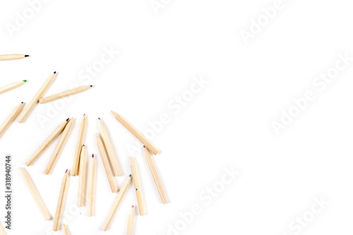 Huge set of colorful pencils on white wooden background. Top view.