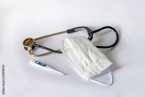 Coronаvirus. Medical mask, phonendoscope, medical thermometer.