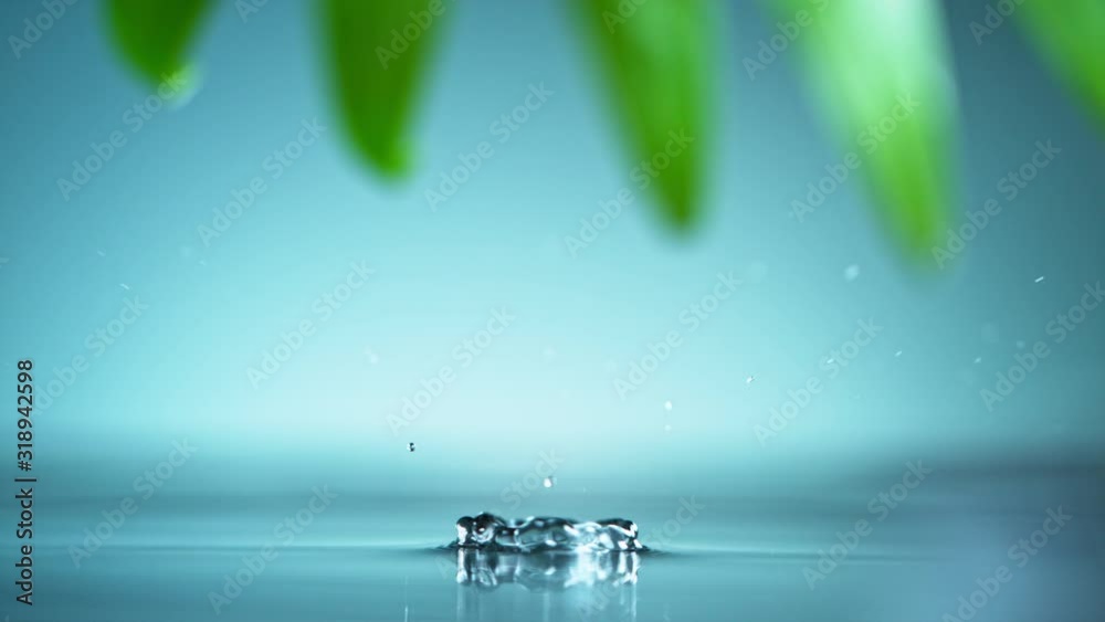 Macro shot of water drop over the water , relaxation with water ripple drops concept , filmed on cinema slow motion camera at 1000 fps
