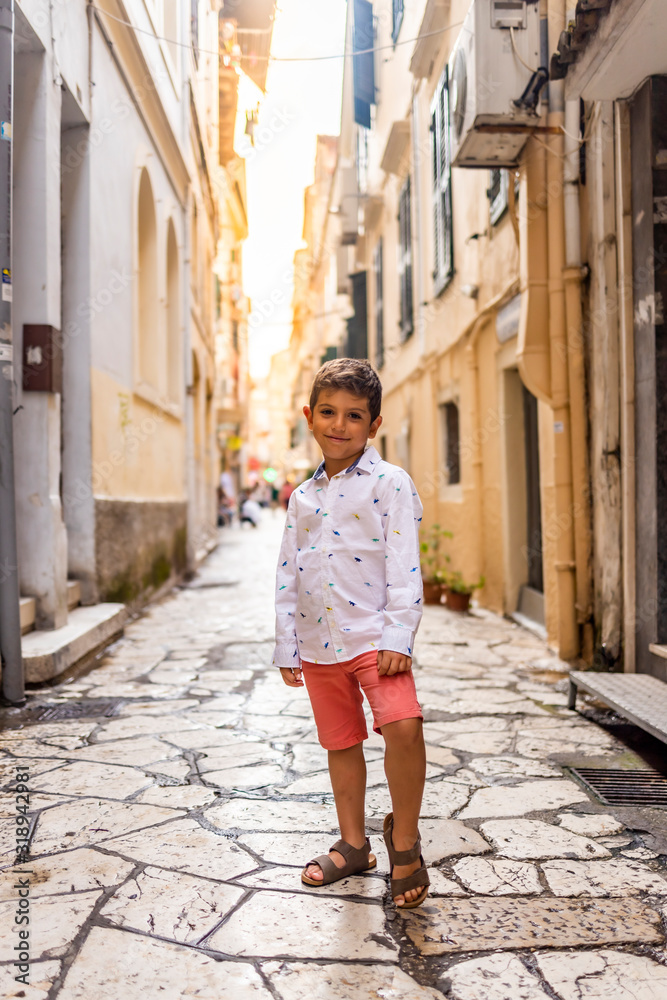 Beautiful little kid on the streets of Corfu, Greece
