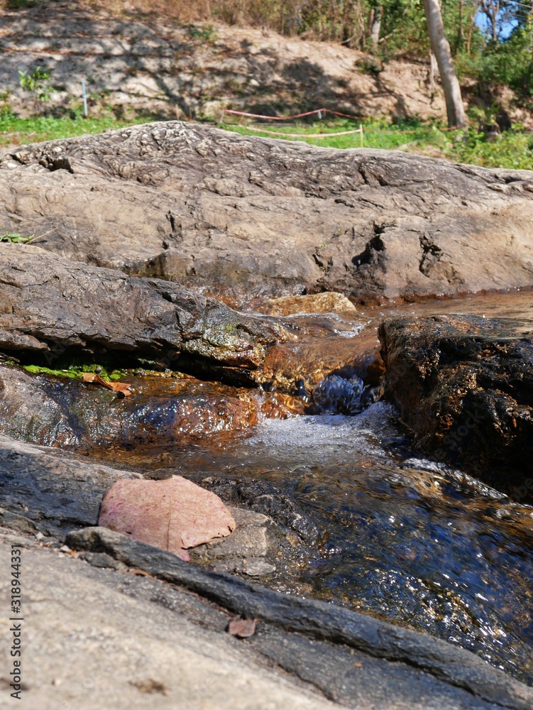 A stream rising from a waterfall in Chiang Mai, Thailand A stream rising from a waterfall in Chiang Mai, Thailand