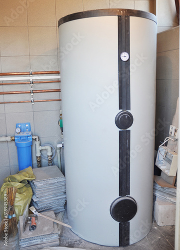 Принти на полотні Condensing boiler, combi boiler hot water tank for house heating in boiler room