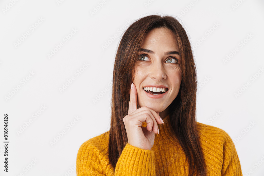 Image of brunette adult woman thinking and looking upward at copyspace Image of brunette adult woman thinking and looking upward at copyspace