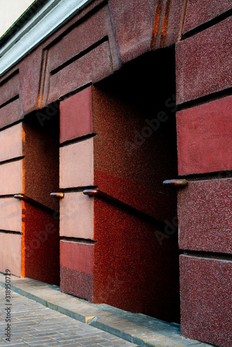 Photo of a modern brick wall with a colorfull graffiti style design outdoor