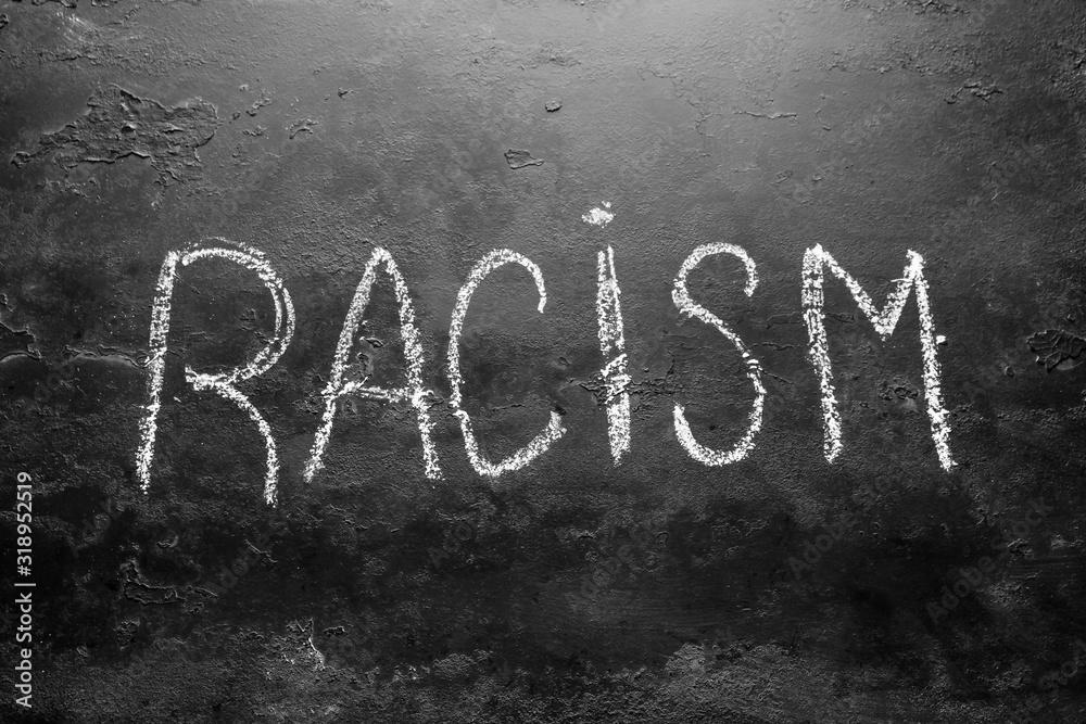 Fototapeta premium racism inscription on a black background concept Stop racism