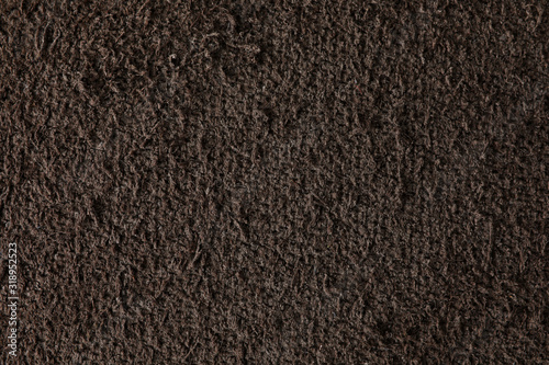 Dark brown leather sample as background pattern