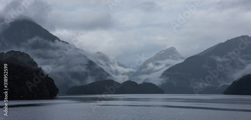 Clouds and fog at Doubtfull Sound. Fjordland New Zealand. South Island. photo