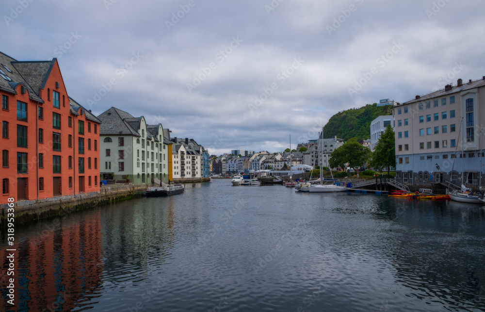 Picturesque summer view of Alesund port town on the west coast of Norway, at the entrance to the Geirangerfjord. Colorful morning cityscape. Traveling concept background.