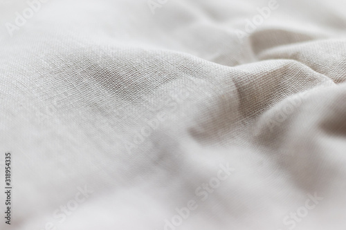 Natural linen fabric texture. Rough crumpled burlap background. Selective focus. Closeup view photo