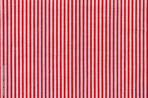 Red and white striped fabric texture. Bright colored cotton background