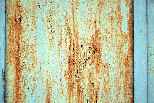 Metal texture, rusty metal with peeling paint, pieces of metal with welds. Background, copy space.