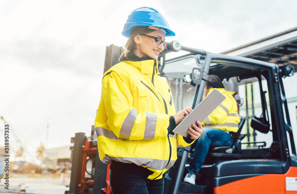 Worker in delivery center planning the logistics Worker in delivery center planning the logistics